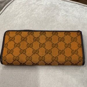 Gucci Tan and Brown Patterned Wallet look at photos